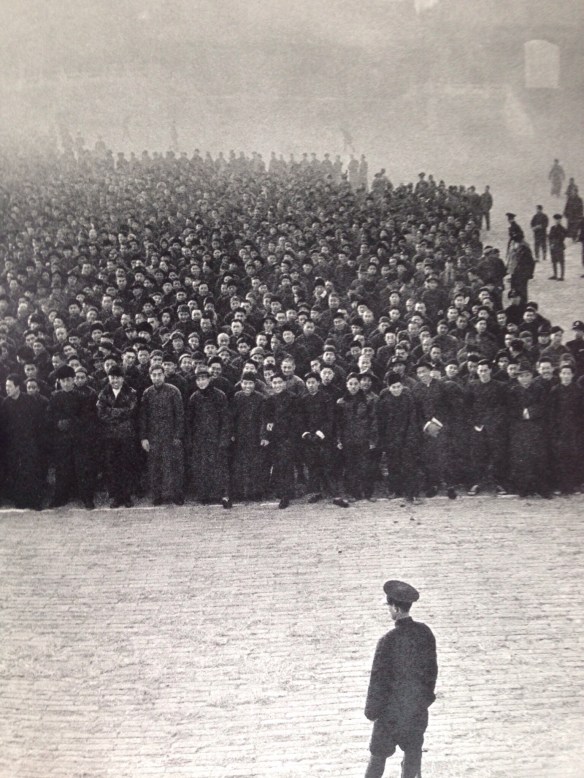 Eight o'clock in the moring at the Imperial Palace in Peking. Ten thousand recruits, mobilized principally from the ranks of small traders, line up to form a new Nationalist regiment.
