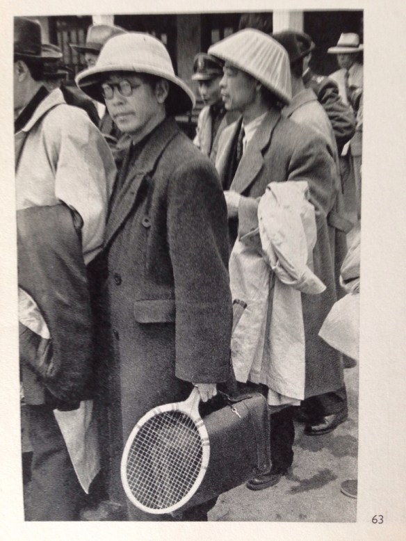 High officials about to take off by plane for Formosa. The tennis racket looks more like a holiday departure.